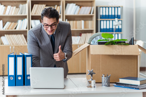 Man moving office with box and his belongings