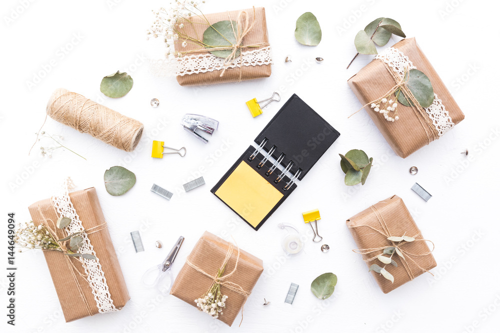 Wrapped gift boxes with flowers. Flat lay decorations Wrapped gift boxes with flowers. Flat lay decorations