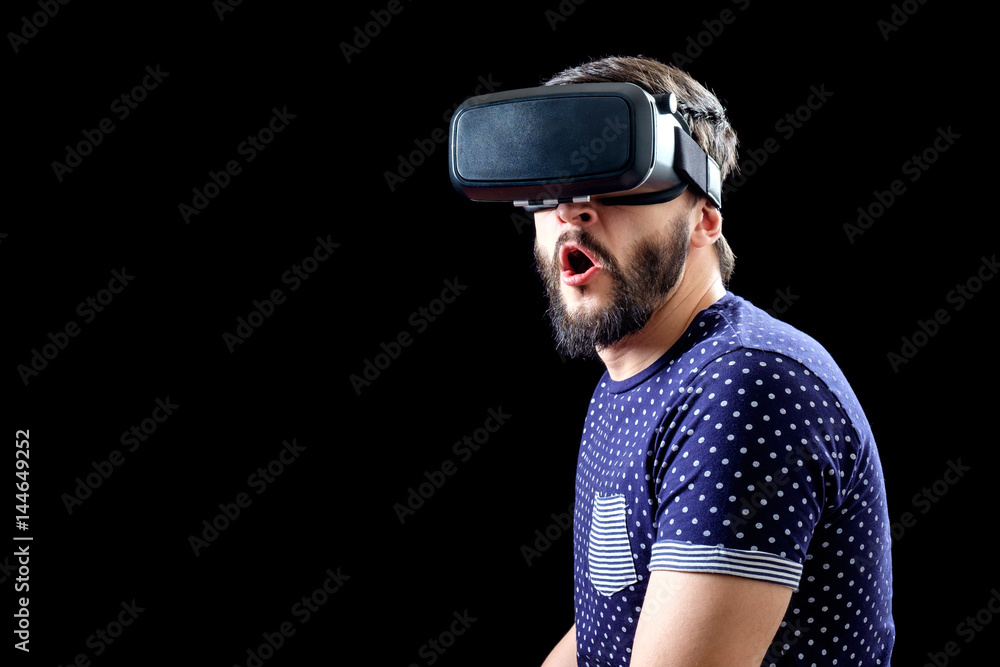 Young happy man experiencing virtual reality Young happy man experiencing virtual reality