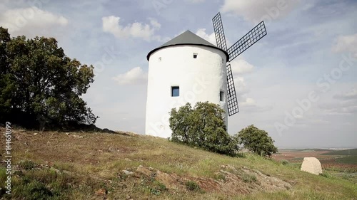 white windmill in Puerto Lápice, province of Ciudad Real, Castile-La Mancha, Spain photo