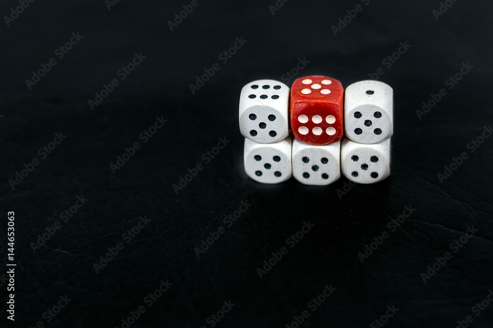 Dice five fives and red six on a black background Dice five fives and red six on a black background