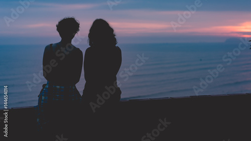Two girls at sunset