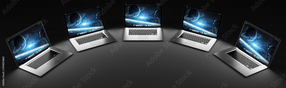 Five modern laptop in the dark 3D rendering Five modern laptop in the dark 3D rendering