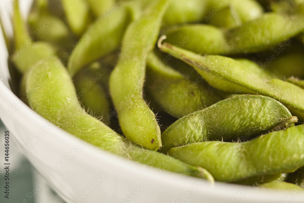 a bowl of cooked soybean pods called a bowl of cooked soybean pods called