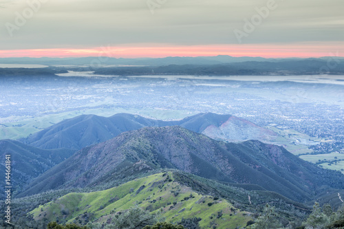 Sunset over Eagle Peak and Bald Ridge via the Main Peak, with the city of Clayton in the background. Mount Diablo State Park, Contra Costa County, California, USA.
