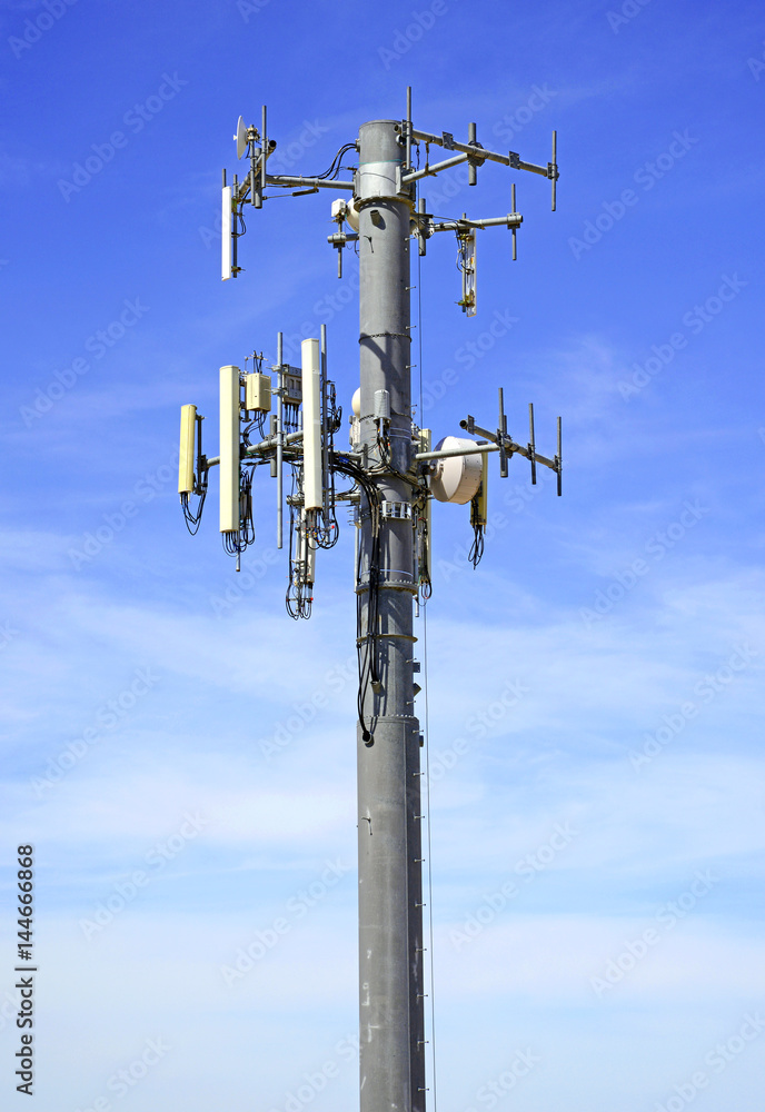 Cell site with wireless cell tower communications station for mobile cellular phone usage Cell site with wireless cell tower communications station for mobile cellular phone usage
