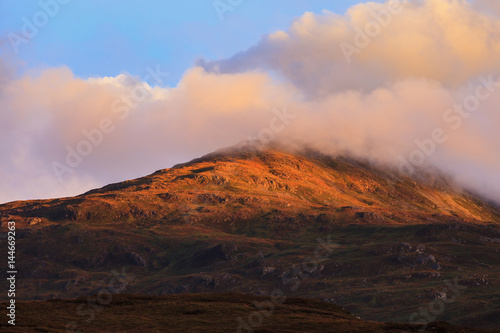 Beautiful mountain peak during sunset with dramatic cloud, Isle of Skye, Hightland, Scotland