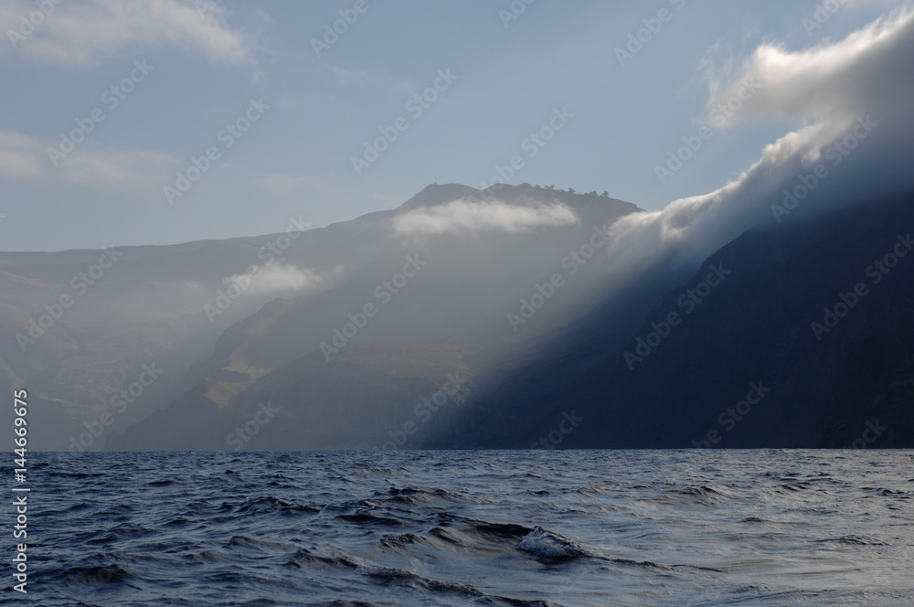 Fog rolls in off of Guadelupe Island off the coast of Mexico Fog rolls in off of Guadelupe Island off the coast of Mexico