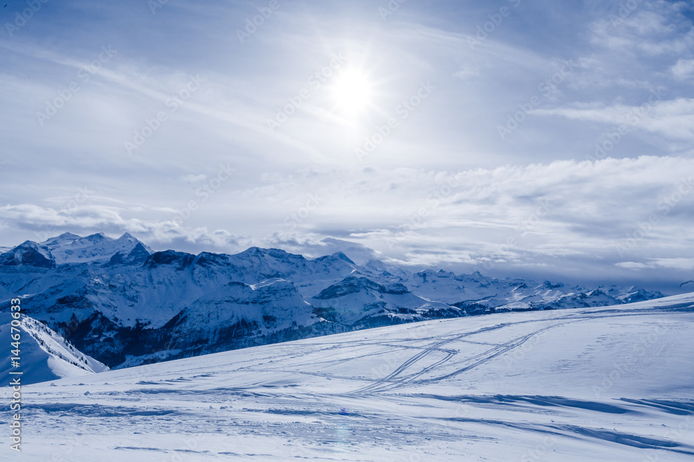 mountain in winter, covered of snow. turns in a sunny day mountain in winter, covered of snow. turns in a sunny day