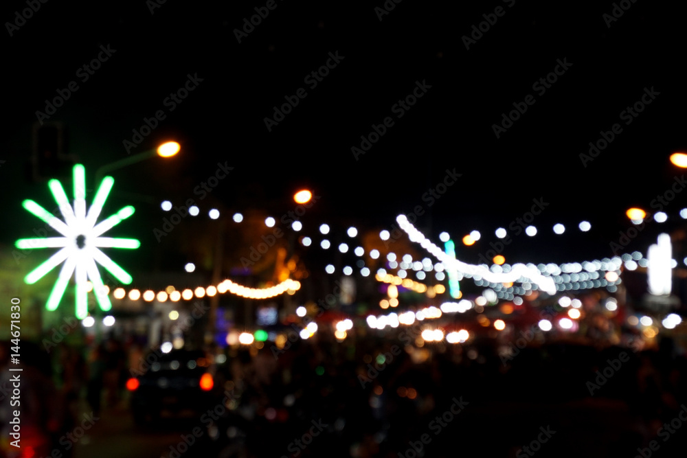 Defocused and blurred image of decoration neon at night amusement park