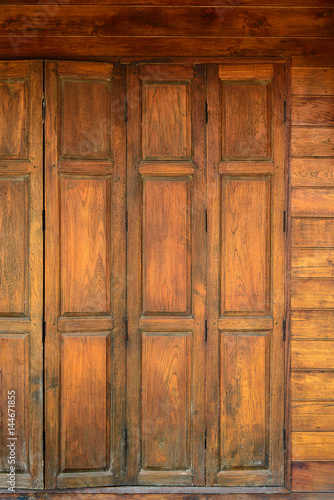 Old grunge wood simple door and wooden wall