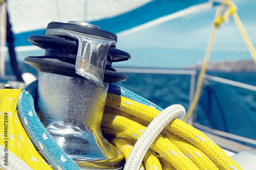 Winch and ropes on a sailboat close up
