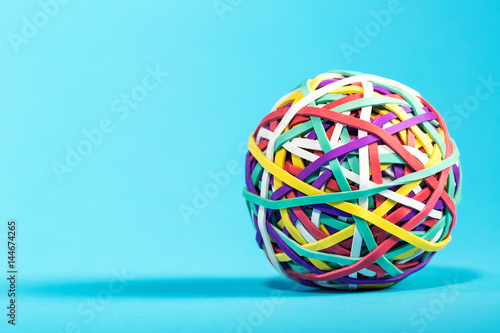 Rubber band ball on blue background