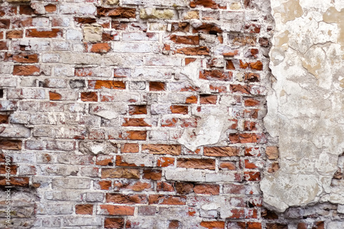 Messy and weathered red brick wall texture. 