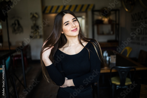 Beautiful young woman in cafe shop