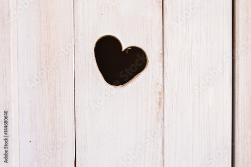 Wooden board with cut out heart shape
