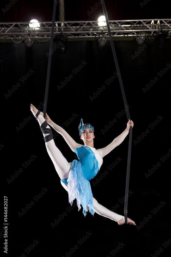 Young woman circus air gymnast Young woman circus air gymnast