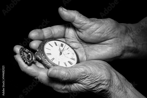 Konstfotografi Senior woman hands holding ancient clock