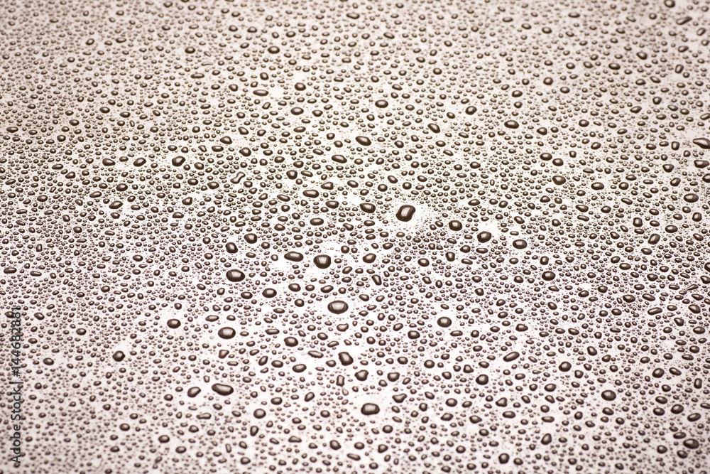 closeup to water drops on glass with lighting background closeup to water drops on glass with lighting background