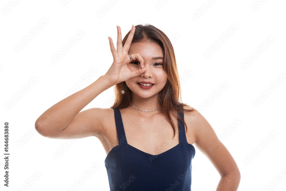 Beautiful young Asian woman show OK sign over her eye. Beautiful young Asian woman show OK sign over her eye.