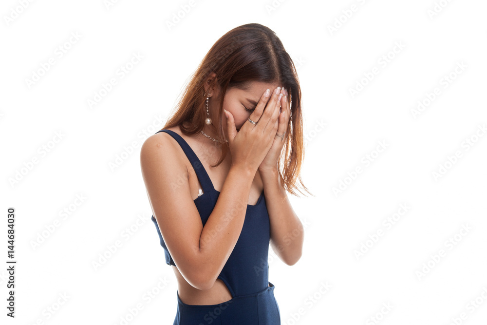 Sad young Asian woman cry with palm to face. Sad young Asian woman cry with palm to face.