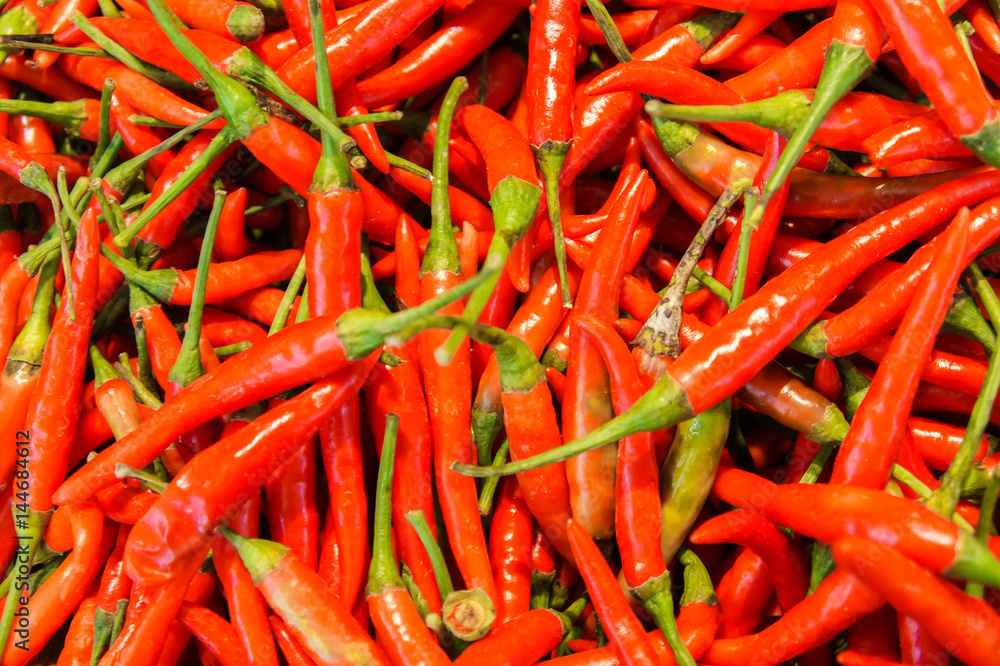 Fresh red chili pepper in the market. For food, kitchen, texture, background and vegetables. Fresh red chili pepper in the market. For food, kitchen, texture, background and vegetables.