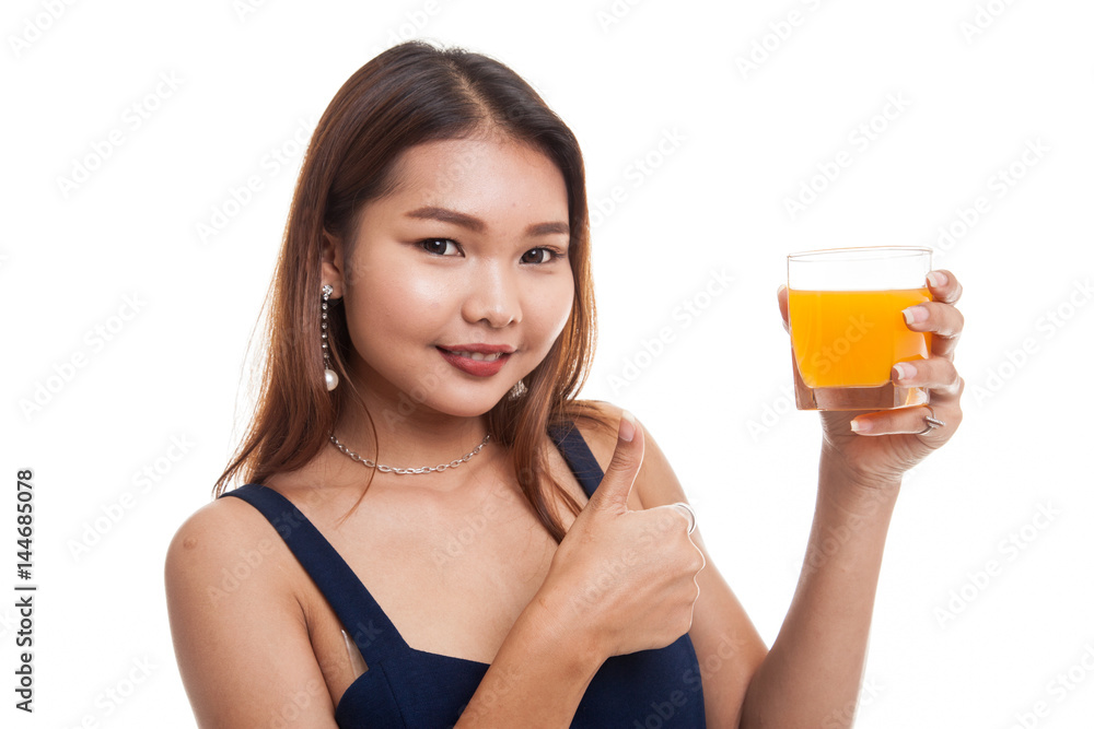 Young Asian woman thumbs up drink orange juice. Young Asian woman thumbs up drink orange juice.