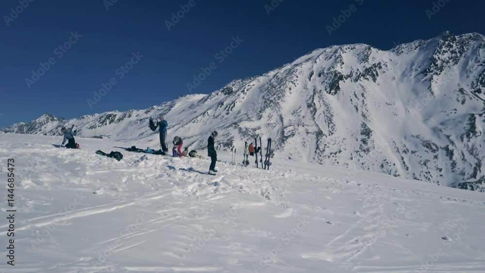 Scenic winter aerial flight of drone over the mountains, crowd of people having a rest on the top on it. Beautiful panorama, sunny day on ski resort. Obergurgl, Austria. 4K. Scenic winter aerial flight of drone over the mountains, crowd of people having a rest on the top on it. Beautiful panorama, sunny day on ski resort. Obergurgl, Austria. 4K.