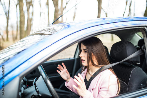 Woman driver scared shocked before crash or accident hands out of wheel © F8  \ Suport Ukraine