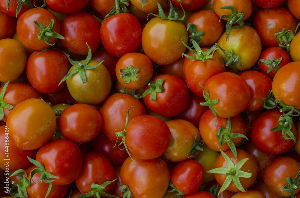 photo of very fresh tomatoes presented on background photo of very fresh tomatoes presented on background