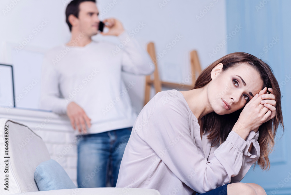Unhappy cheerless woman suffering from depression Unhappy cheerless woman suffering from depression