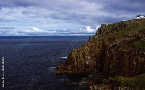 Landscape of towering granite cliffs at Lands End Cornwall England UK Europe