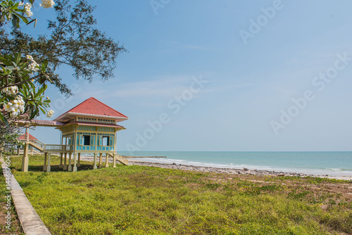 Summer Wood pavilion seaside on blue sky background. © oatautta