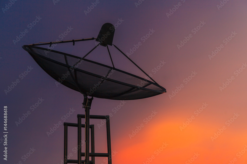 Satellite dish at twilight sky in the city