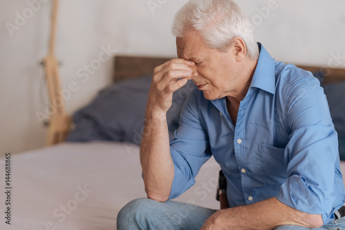 Konstfotografi Moody aged man feeling unhappy