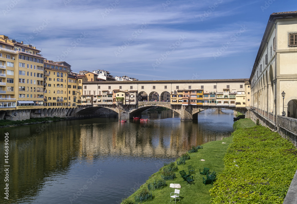 The famous and beautiful Ponte Vecchio bridge over the Arno river, historic center of Florence, Italy
