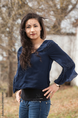 asian woman outdoor smiling to camera