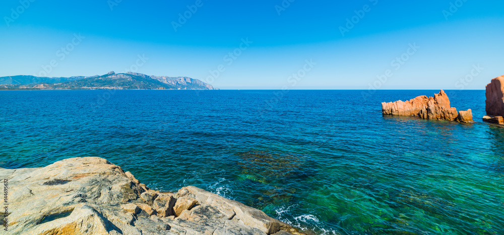 Blue sea and red rocks