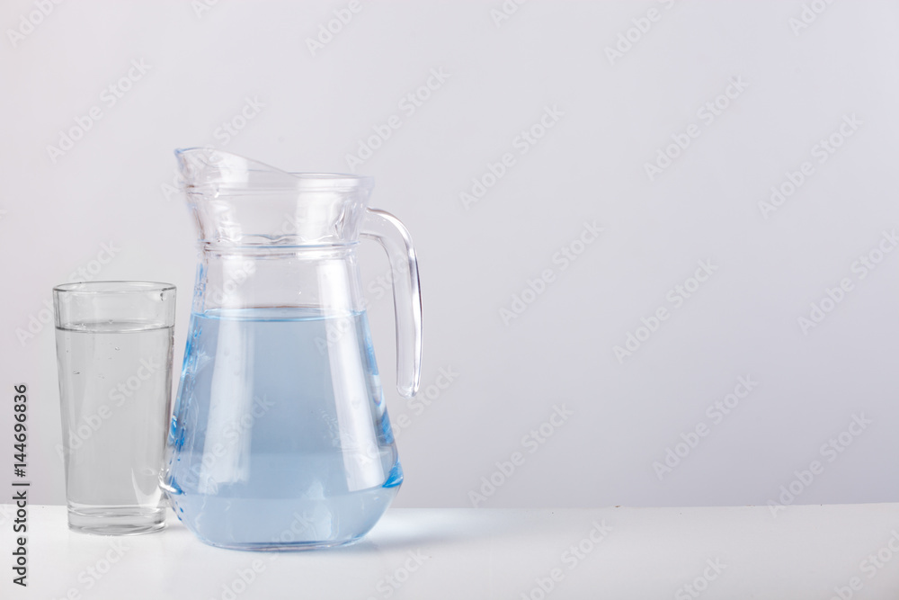 glass jug with water isolated on white background glass jug with water isolated on white background