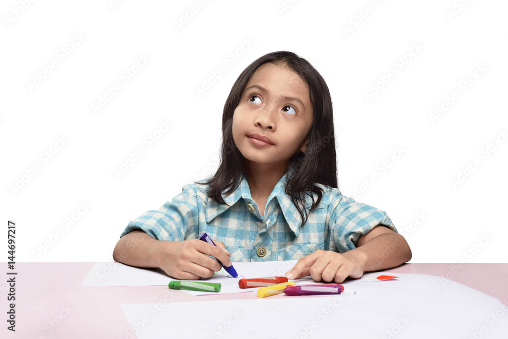 Cute asian little girl with crayon thinking to drawing something Cute asian little girl with crayon thinking to drawing something