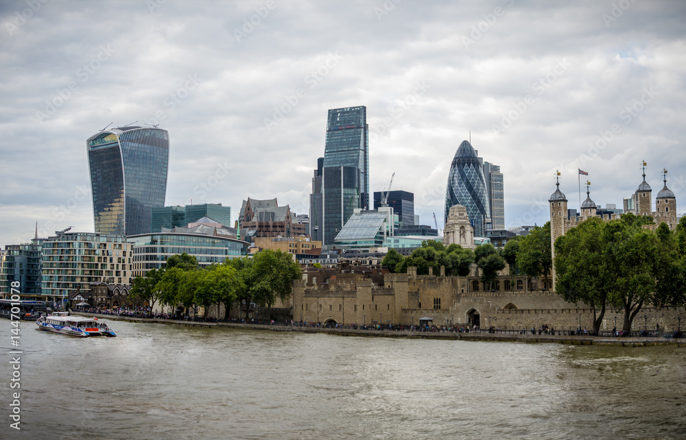 The tower of London and skyscrapers in the City as seen from Tower Bridge The tower of London and skyscrapers in the City as seen from Tower Bridge