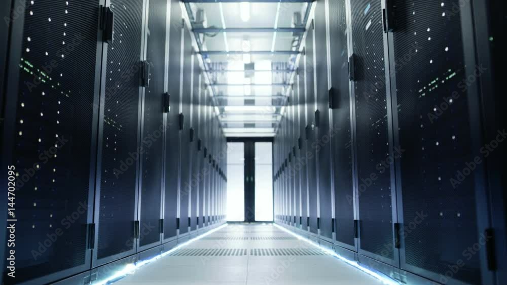 Camera Moves Through Big Working Data Center with Server Racks and Glass Ceiling. Shot on RED EPIC-W 8K Helium Cinema Camera. Camera Moves Through Big Working Data Center with Server Racks and Glass Ceiling. Shot on RED EPIC-W 8K Helium Cinema Camera.