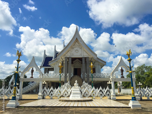 White Buddha statue in front of Buddhist Temple.Wat Phra Putthabat Yasothon, Yasothon, Thailand photo