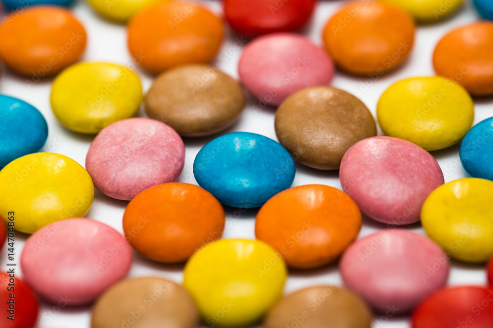 Close up of a pile of colorful chocolate coated candy, chocolate pattern, chocolate background Close up of a pile of colorful chocolate coated candy, chocolate pattern, chocolate background
