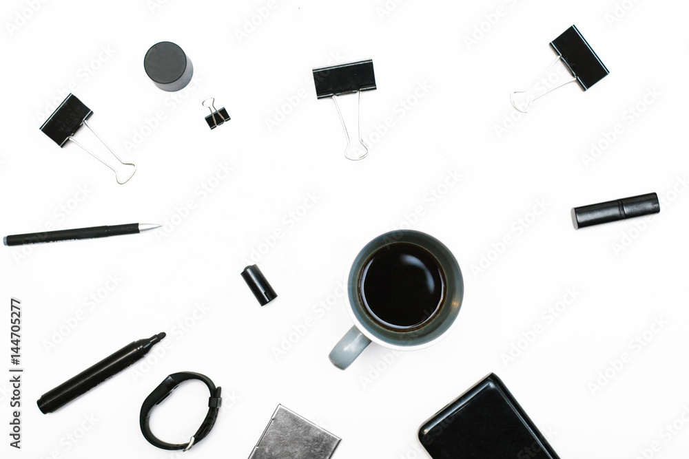 Home office workspace with coffee and female accessories: bracelet, watch, lipstick and notebook. Flat lay, top view