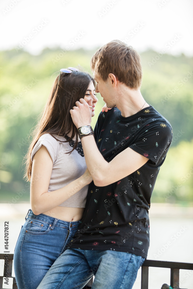 Fototapeta premium Inlove couple taking a walk in the park. Lifestyle and relationship. Young inlove boyfriend and girlfriend