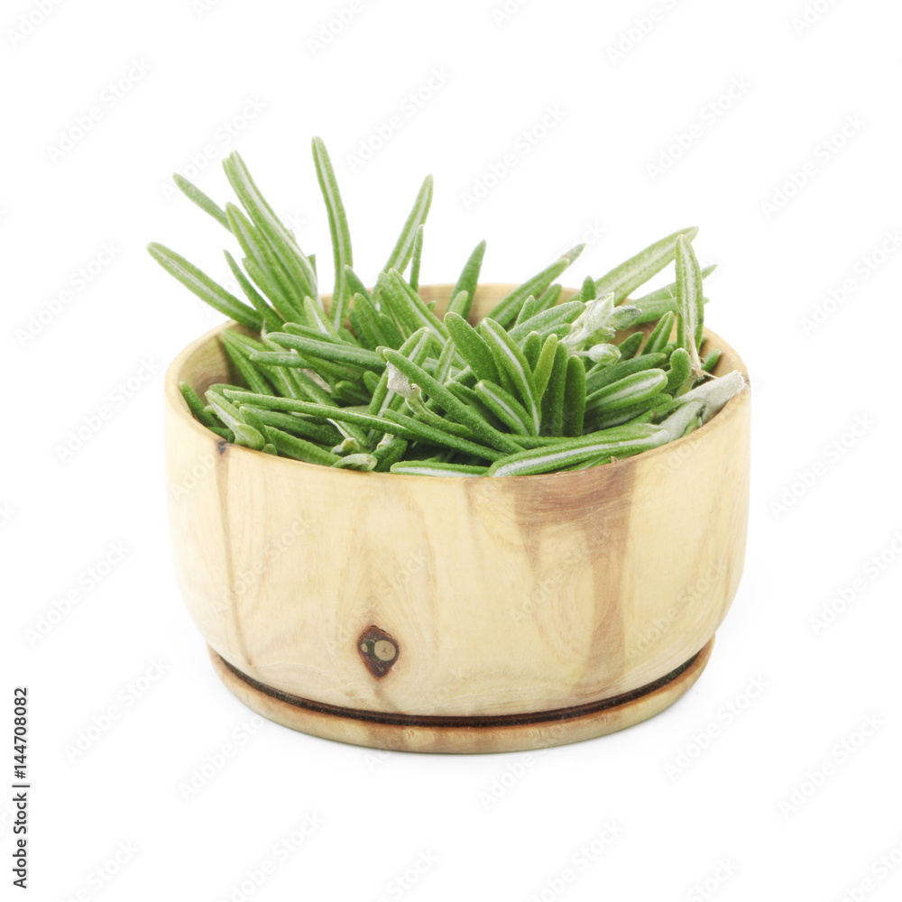 rosemary in wooden cup isolated on white background rosemary in wooden cup isolated on white background