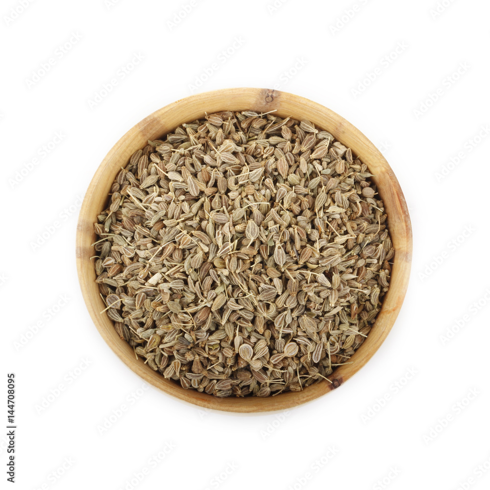 anise in wooden cup isolated on white background anise in wooden cup isolated on white background