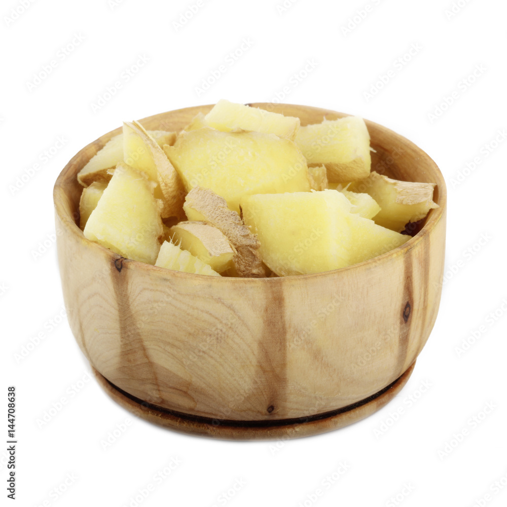 slices of ginger in wooden cup isolated slices of ginger in wooden cup isolated