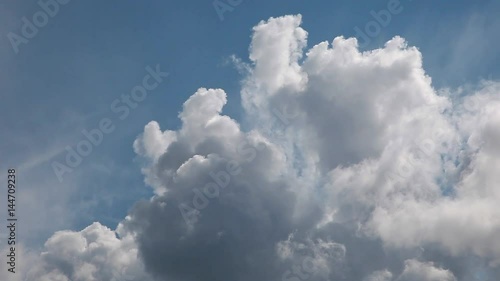 Timelapse of cumulus clouds forming on a clear blue sky